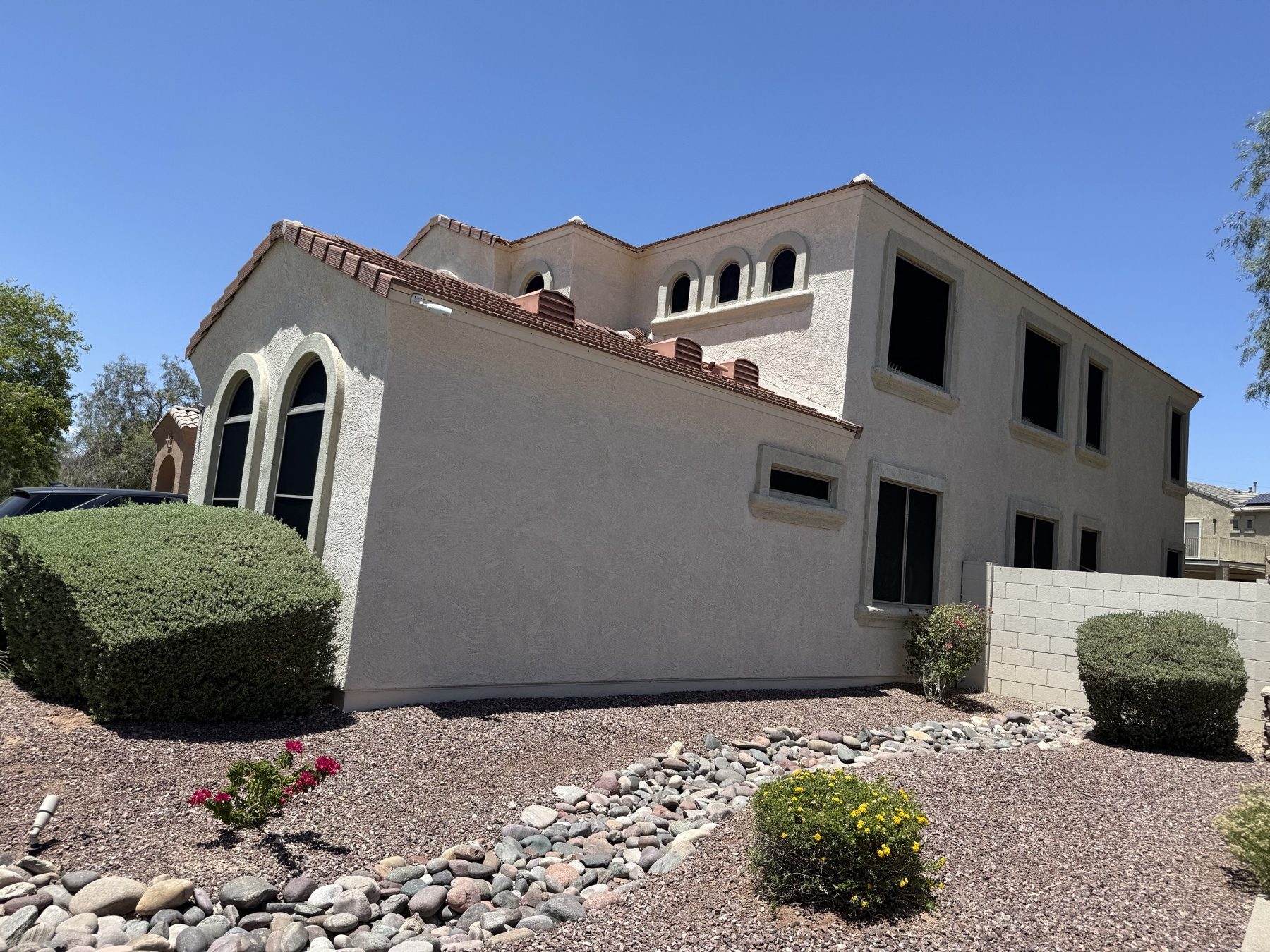 Clean stucco exterior and windows after detailing