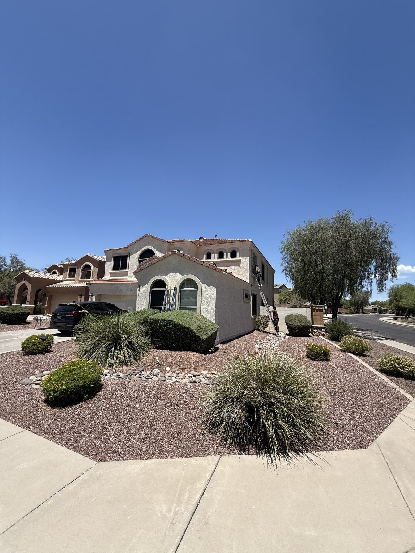 Two-story home exterior with desert landscaping