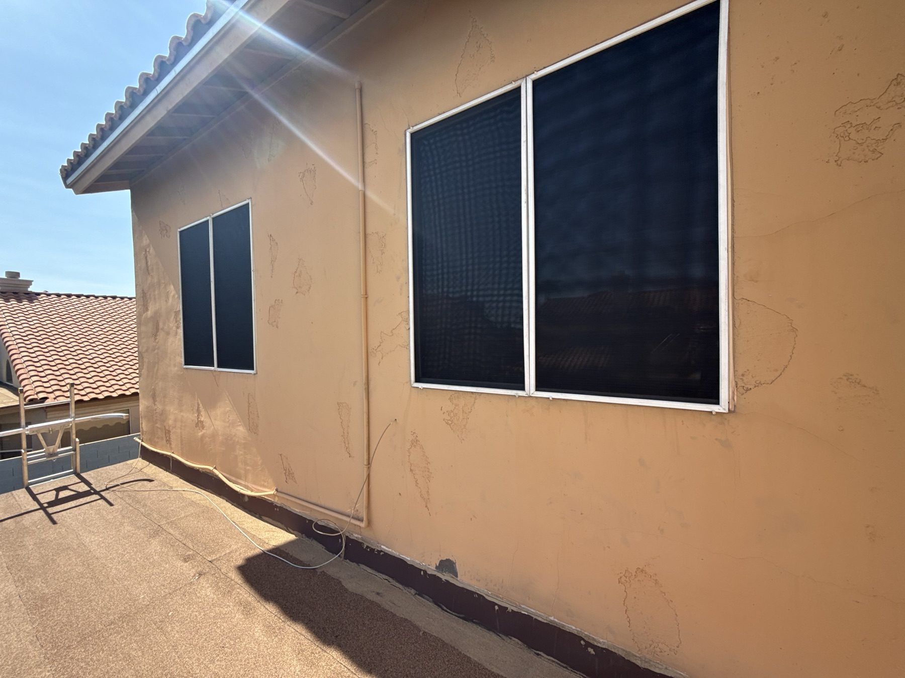 The same windows fitted with fresh solar screens by REBEL