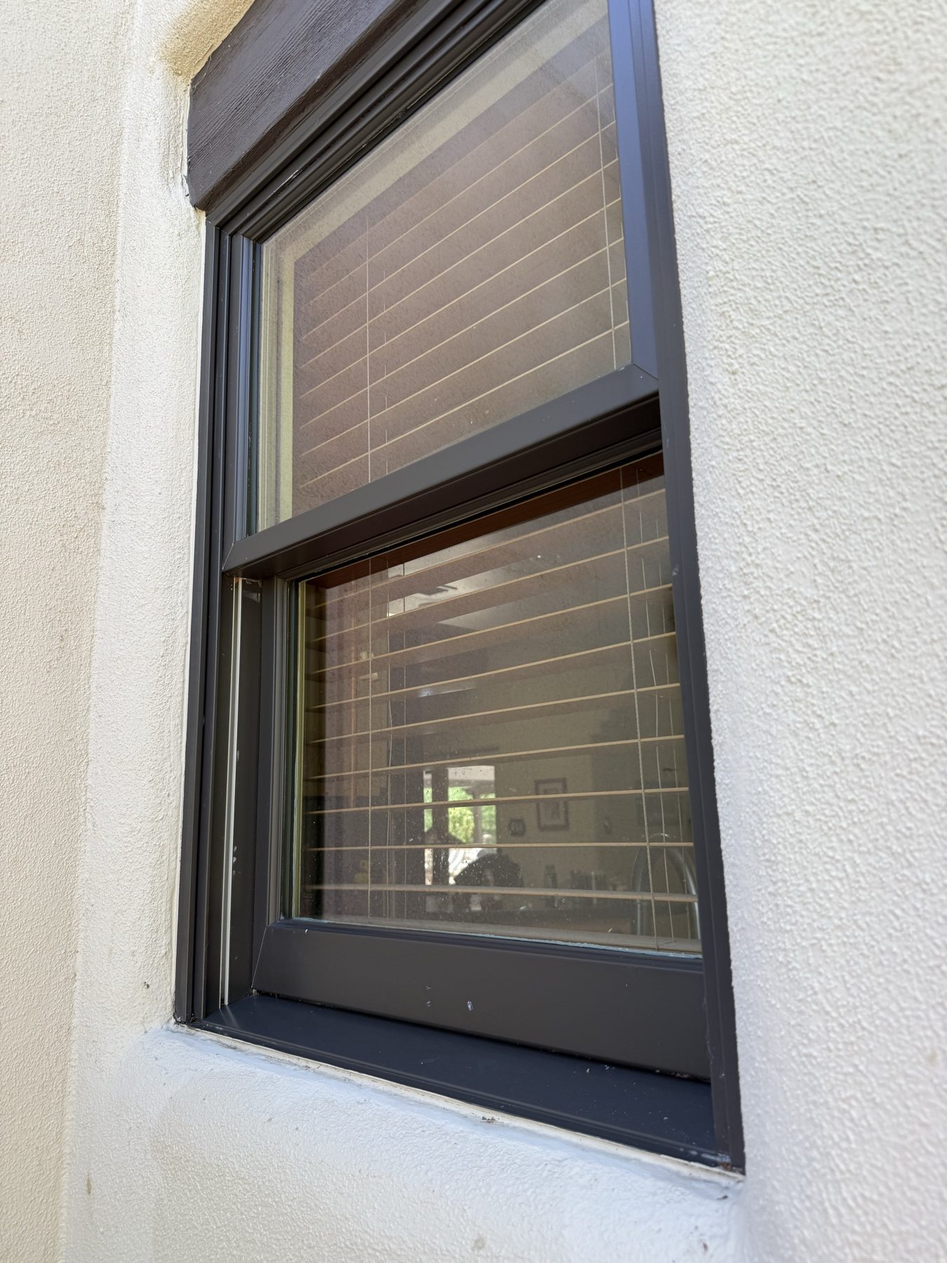 The same double-hung window bright and clean after REBEL service